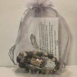 Aroma therapy Lava Stone Diffuser bracelet with Essential Oil sample.